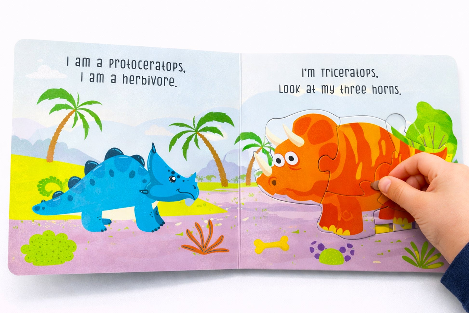 Dinosaur Puzzle Board Book top view showing colourful pages